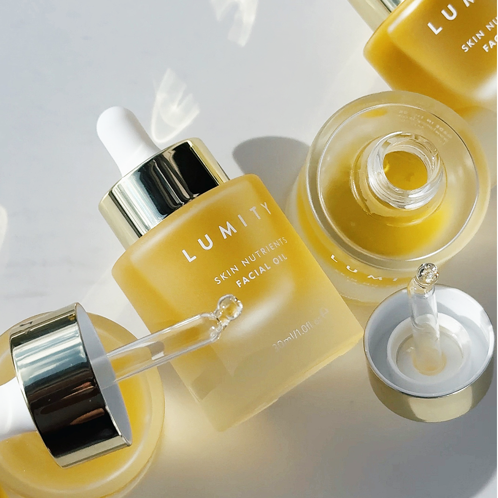 Lumity Skin Nutrients Facial Oil Bottles on a light background