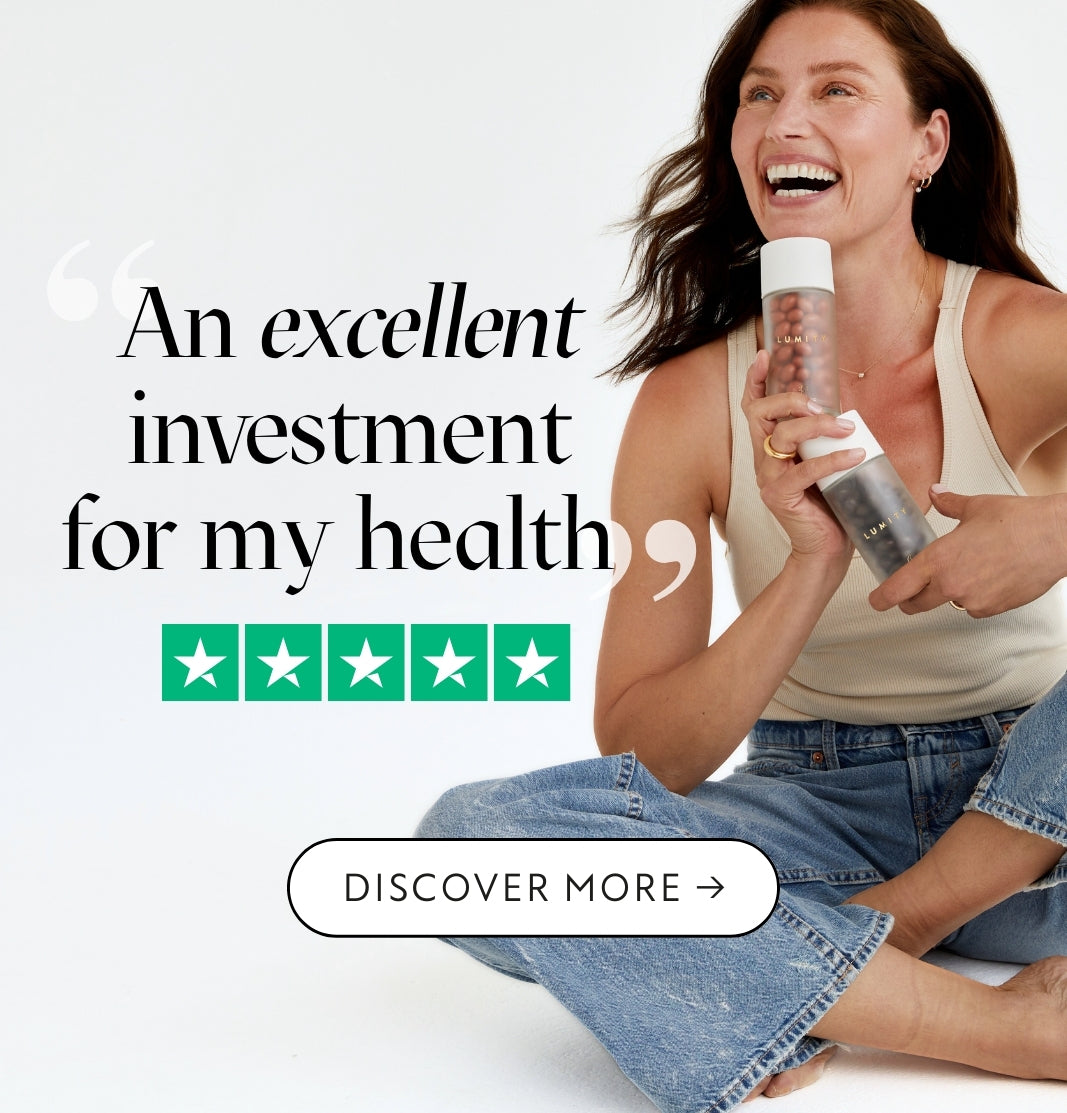 Woman holding a Lumity supplement bottles with text about health investment on a white background