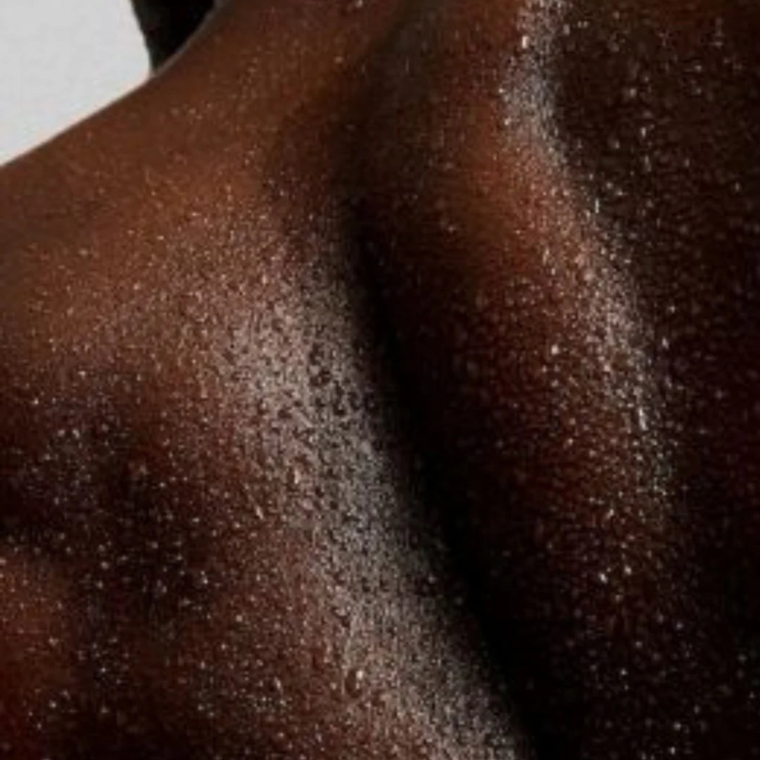Close-up of a person's back  on a neutral background