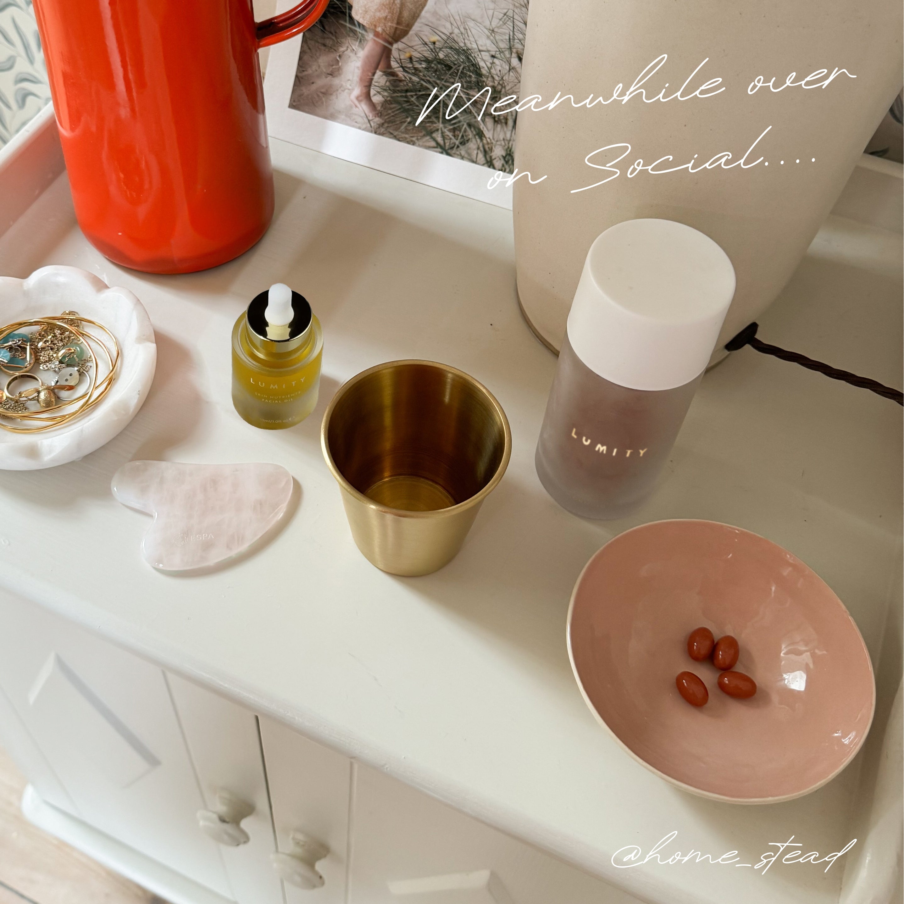 Morning and night supplements with wellness essentials on a white dresser including a dropper bottle and small dish