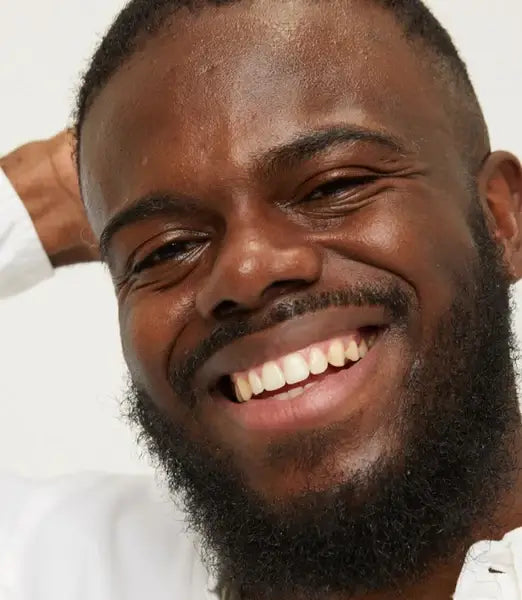 Young man smiling towards camera  - model photoshoot