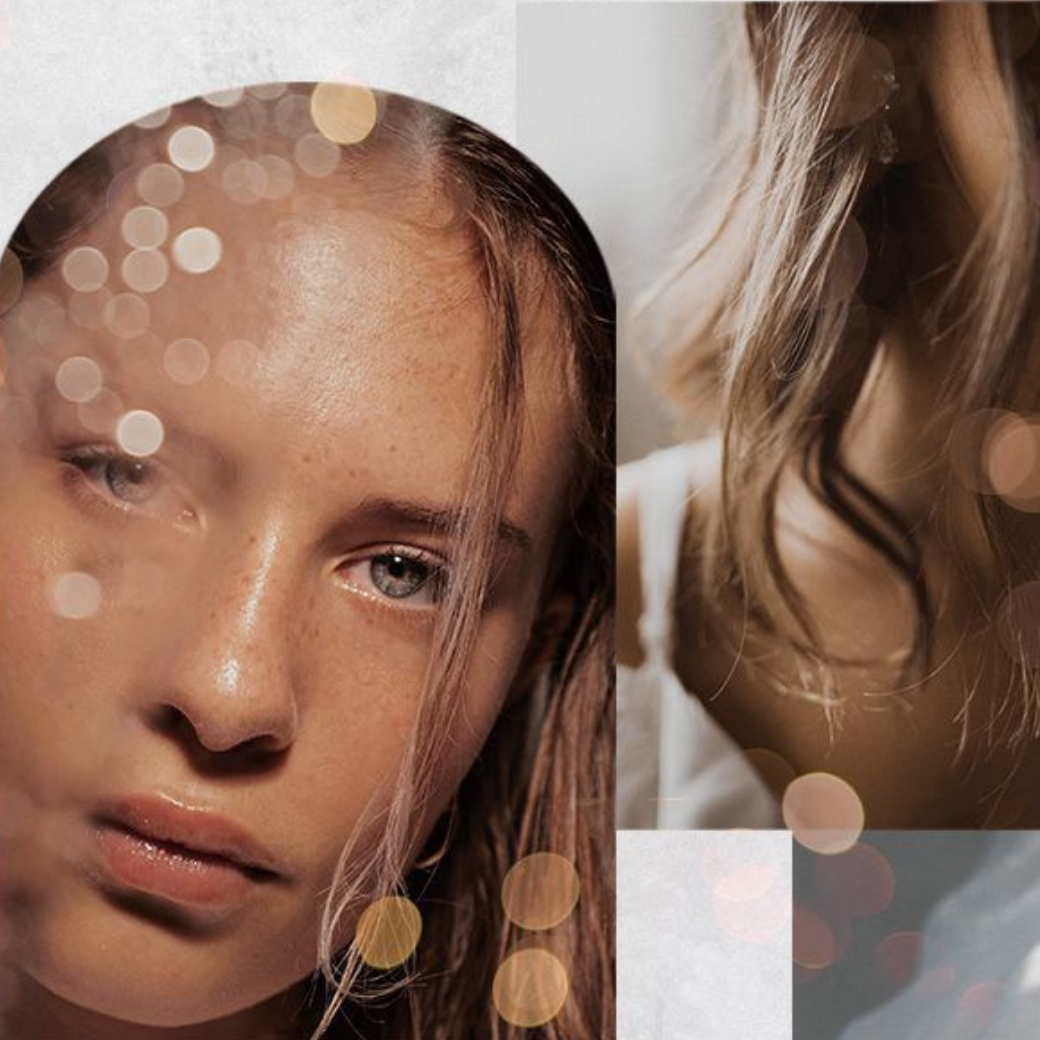 Young woman with clear skin and freckles, light blue eyes, tousled light brown hair, white garment and golden bokeh.