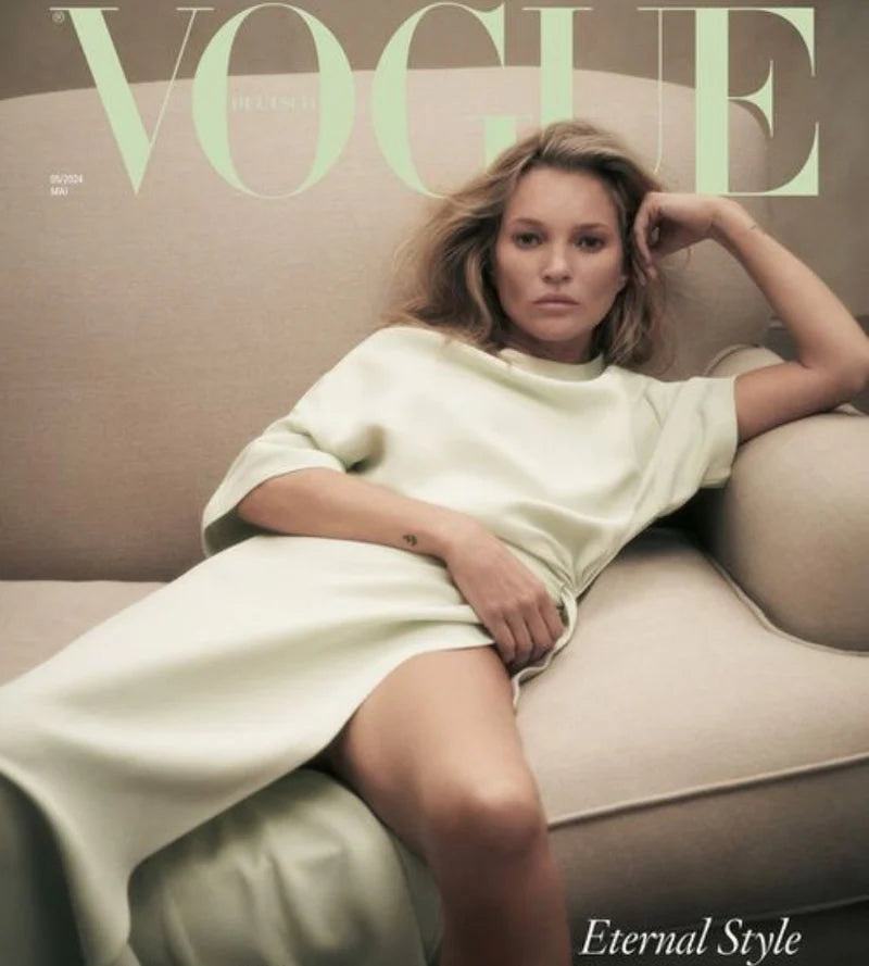 Woman in a white dress sitting on a beige couch , a 'Vogue' magazine cover with title Eternal Style