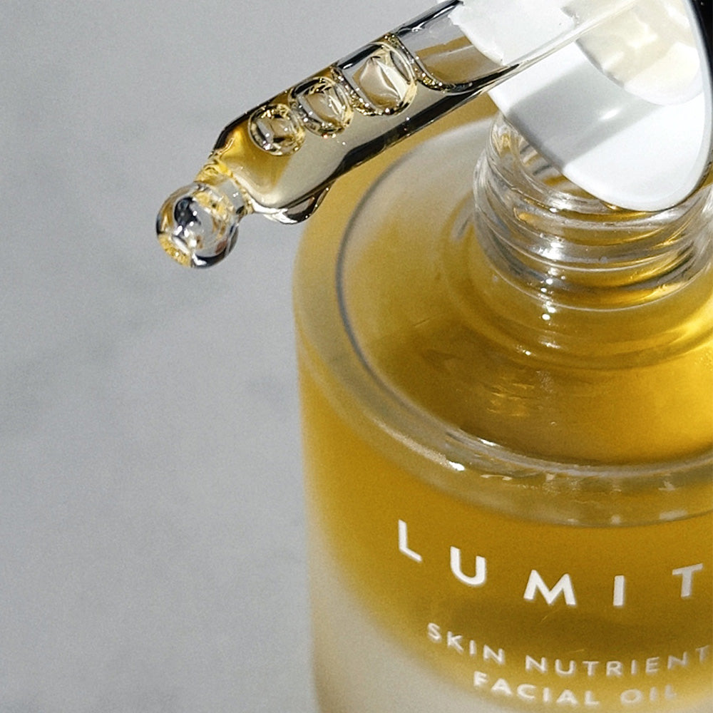Lumity Skin Nutrients Facial Oil Close up with pipette on top of bottle
