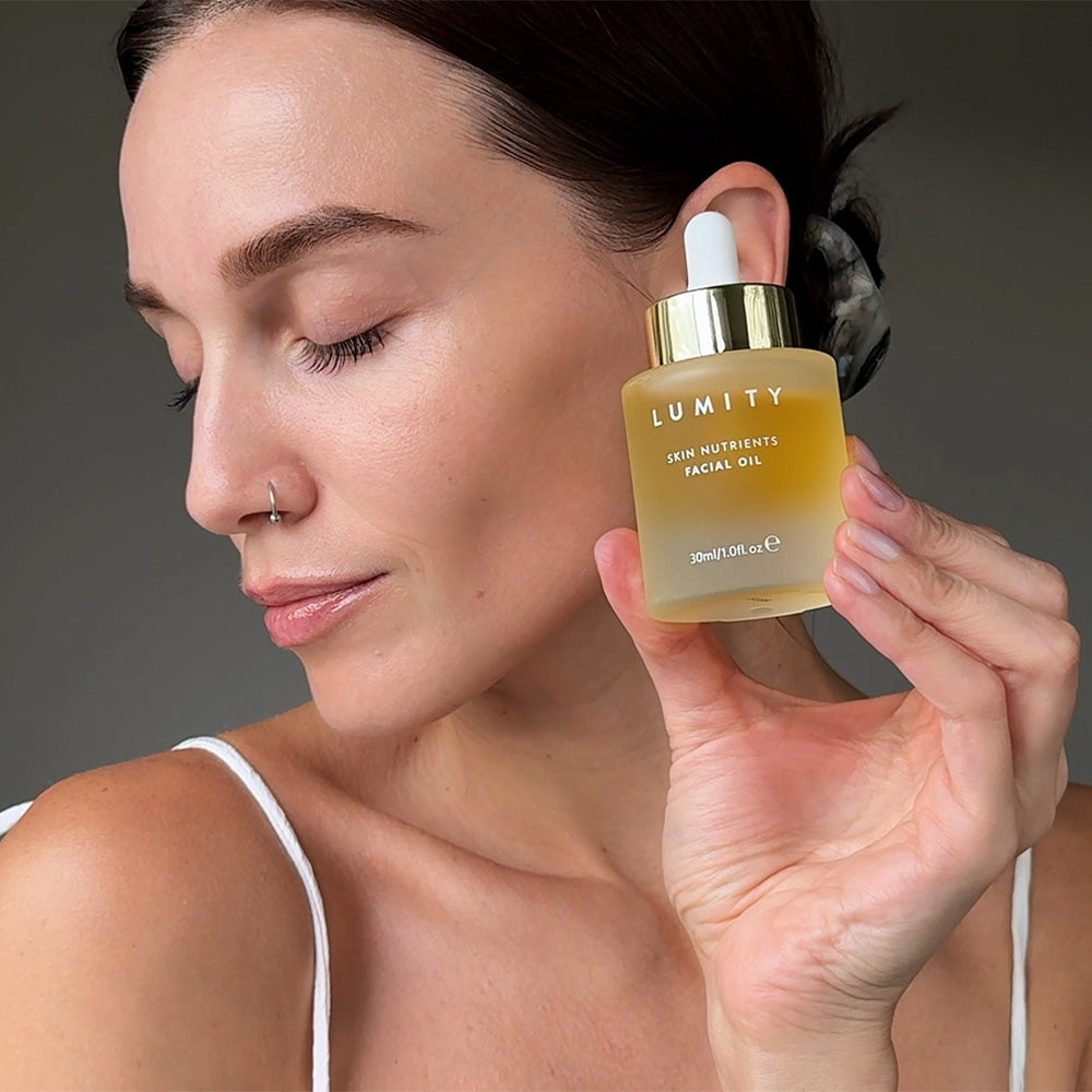 Lumity Skin Nutrients Facial Oil in Models hand