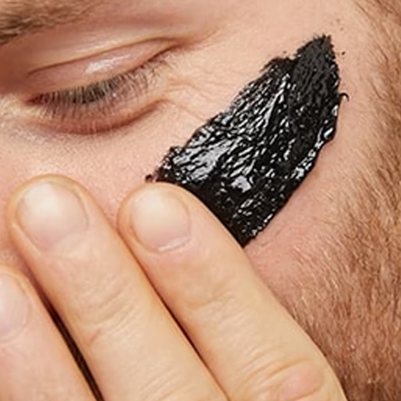 Close up of a person applying Lumity Skin Nutrients 4-in-1 Cleanse to their face